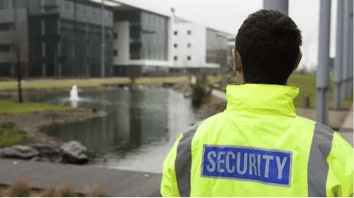 On-site security guard in high visibility jacket